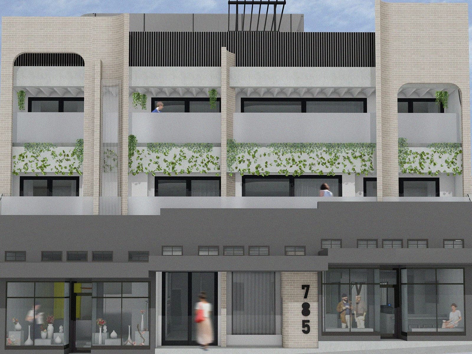 Street elevation of Haus 785, a pale brick apartment block with planted balconies above dark ground-floor shopfronts